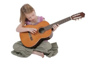 bigstockphoto_Young_Girl_With_Guitar_2339814
